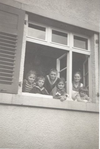 family_looking_out_window