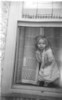 margie child in a window